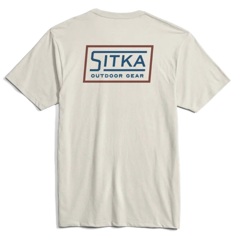 Load image into Gallery viewer, A white Sitka Stencil T-Shirt with the brand's logo printed on the back.