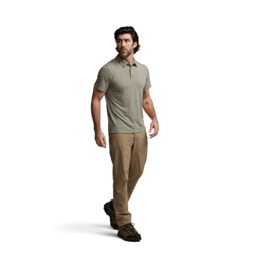 Man wearing a Sitka Essential Short Sleeve Polo – lightweight performance shirt with UPF 50+, odor control, and breathable stretch fabric.