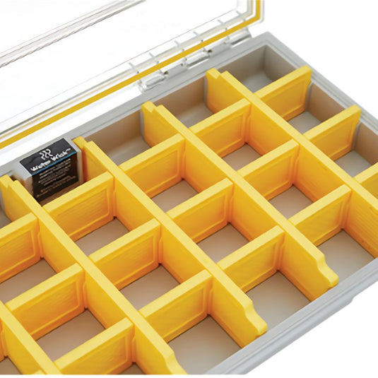Yellow grid organizer inside a clear container with a white lid.