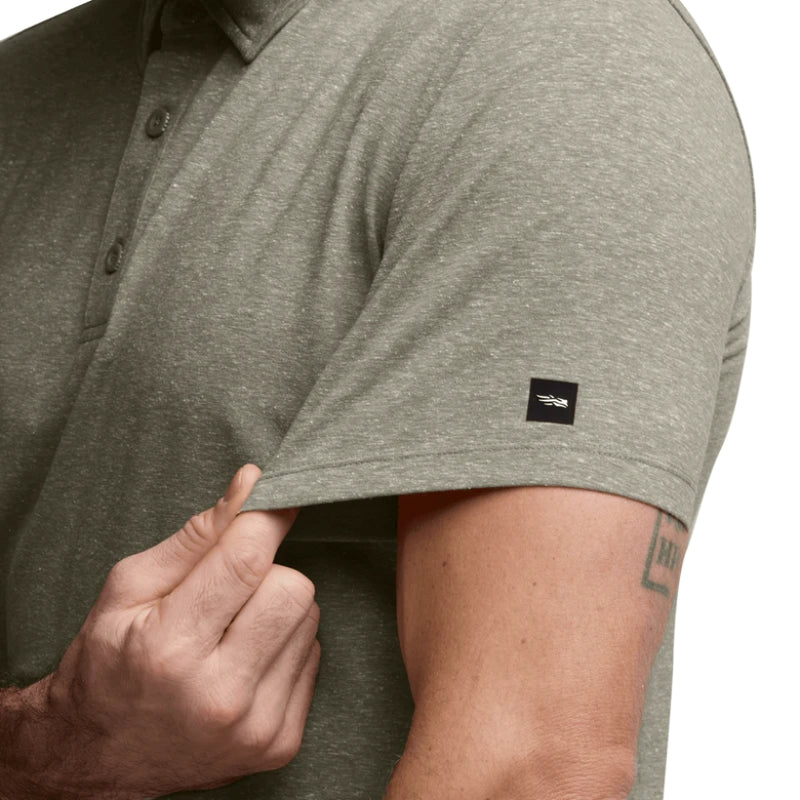 Load image into Gallery viewer, The sleeve of the Sitka Essential Short Sleeve Polo – lightweight performance shirt with UPF 50+, odor control, and breathable stretch fabric.