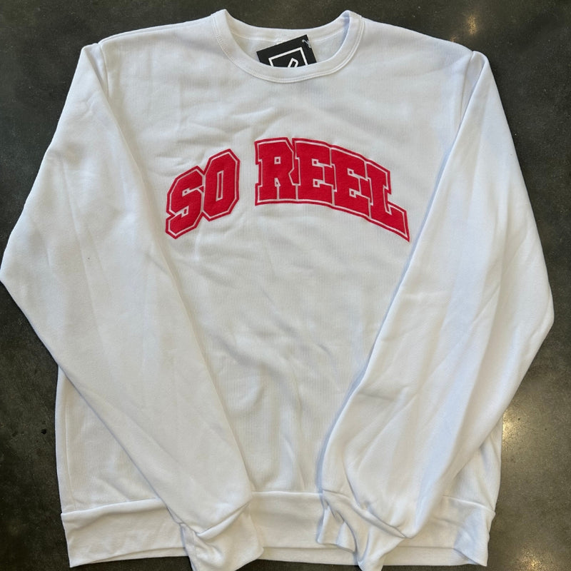 Load image into Gallery viewer, White sweatshirt with red text 'SO REEL' on a dark surface
