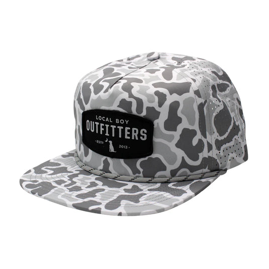 Local Boy Outfitters Perforated Flat Brim Hat with camo design, woven patch, and ventilated back