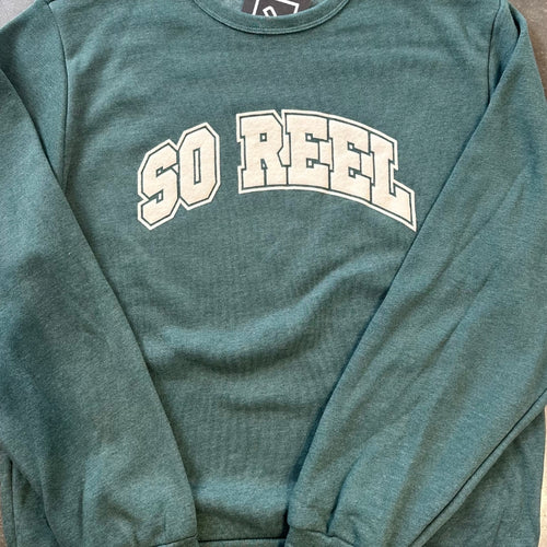 Green sweatshirt with 'SO REEL' text on a plain background